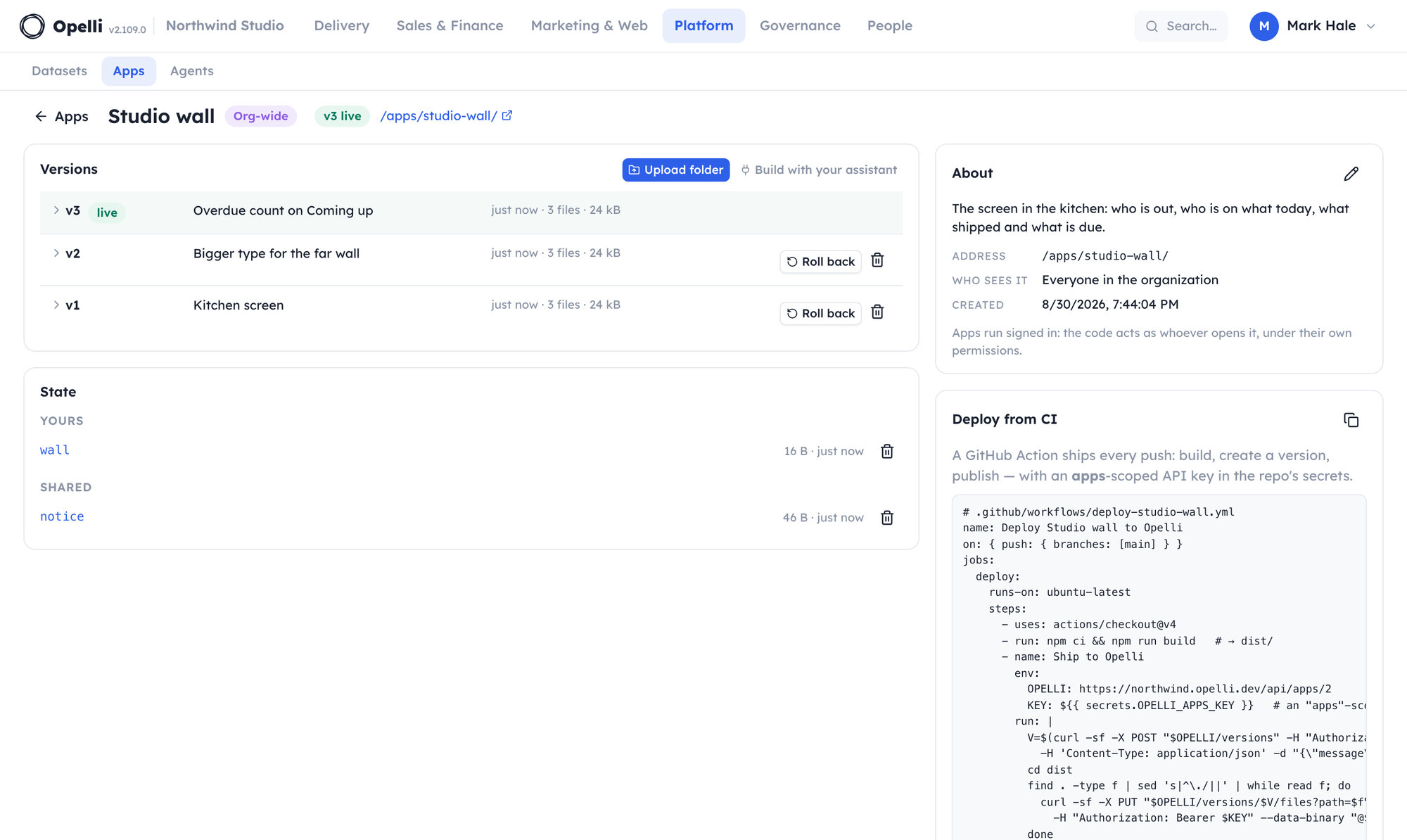 The detail page of an app called Studio wall: the numbered version history with one version live, the app's saved state — shared keys and the viewer's own — and the ready-made CI workflow snippet beside them.